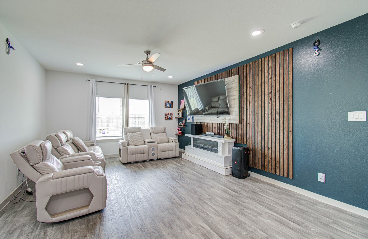 22 Desert Spring Lane Manvel, TX 77578 - Photo 15 of 36 a living room with furniture and a flat screen tv