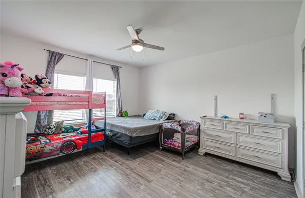 a bedroom with bed and window