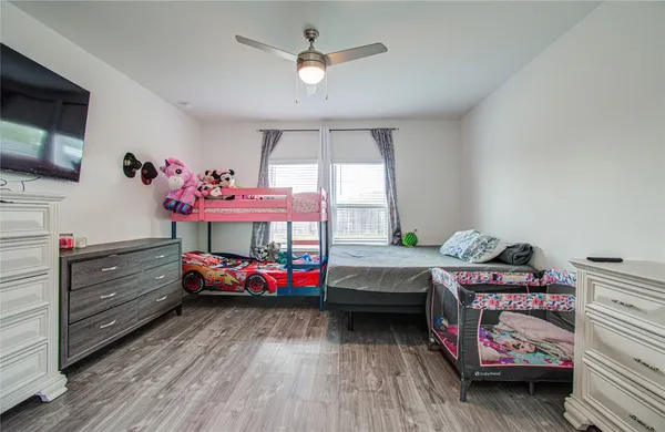 a bedroom with furniture and windows