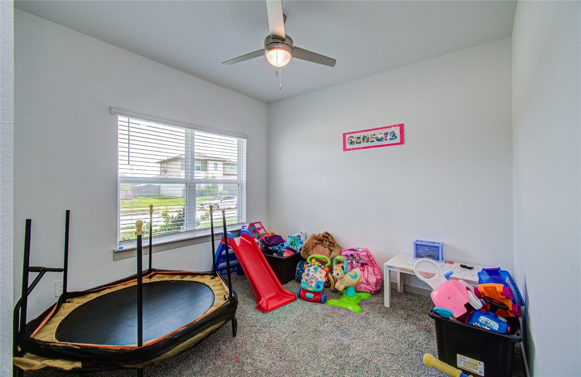 22 Desert Spring Lane Manvel, TX 77578 - Photo 20 of 36 a room with toys and a chandelier