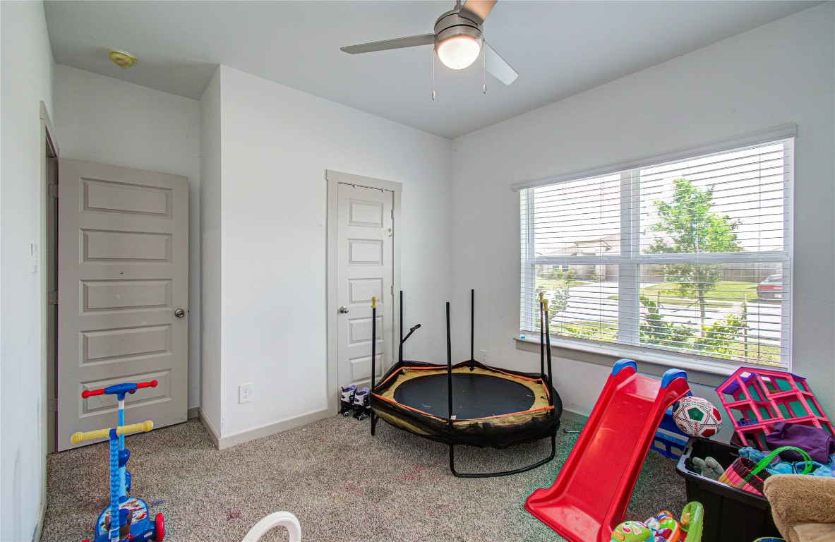 22 Desert Spring Lane Manvel, TX 77578 - Photo 21 of 36 a room with furniture and a window