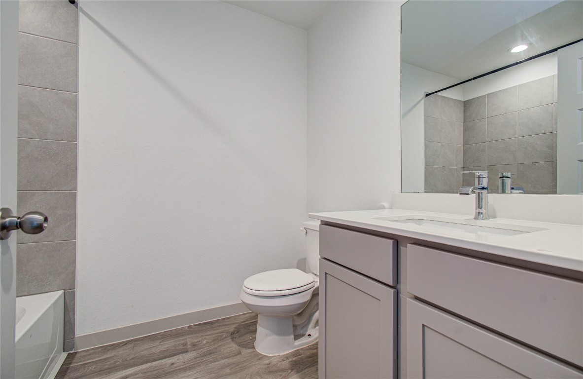 22 Desert Spring Lane Manvel, TX 77578 - Photo 25 of 36 a bathroom with a sink a toilet and a mirror