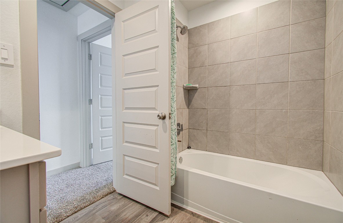 22 Desert Spring Lane Manvel, TX 77578 - Photo 26 of 36 a bathroom with a bathtub and a shower