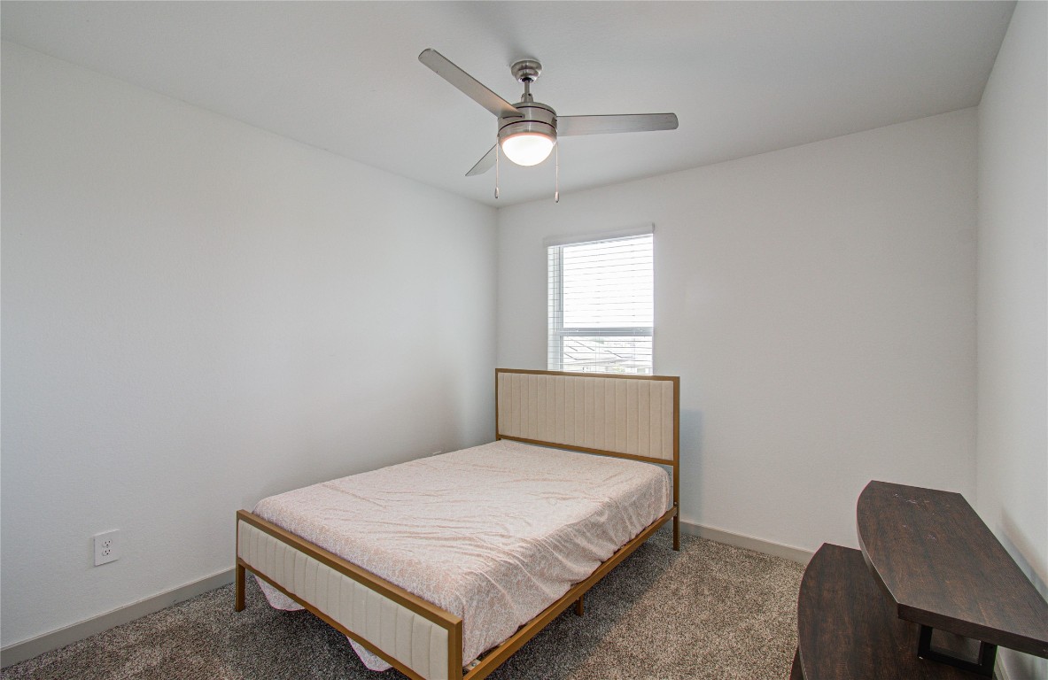 22 Desert Spring Lane Manvel, TX 77578 - Photo 27 of 36 a bedroom with a bed window and a window