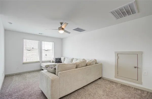 a living room with furniture and window
