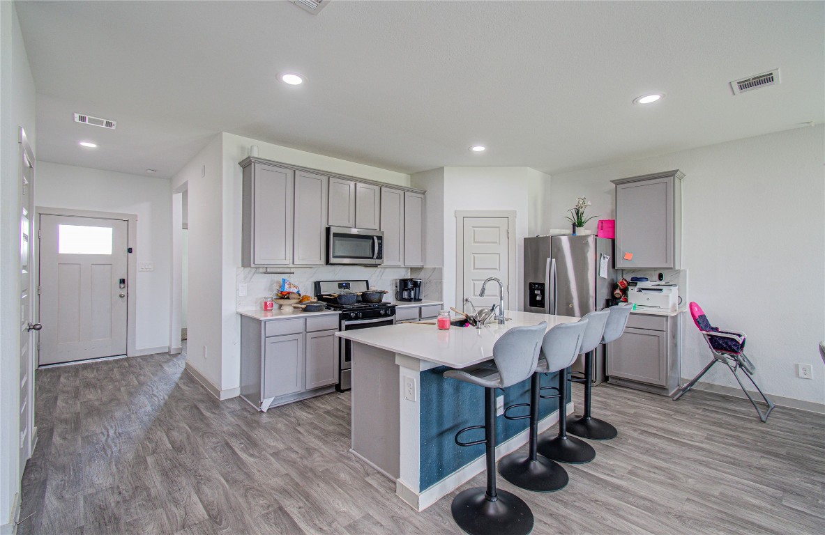 22 Desert Spring Lane Manvel, TX 77578 - Photo 5 of 36 a view of a dining room with furniture and wooden floor