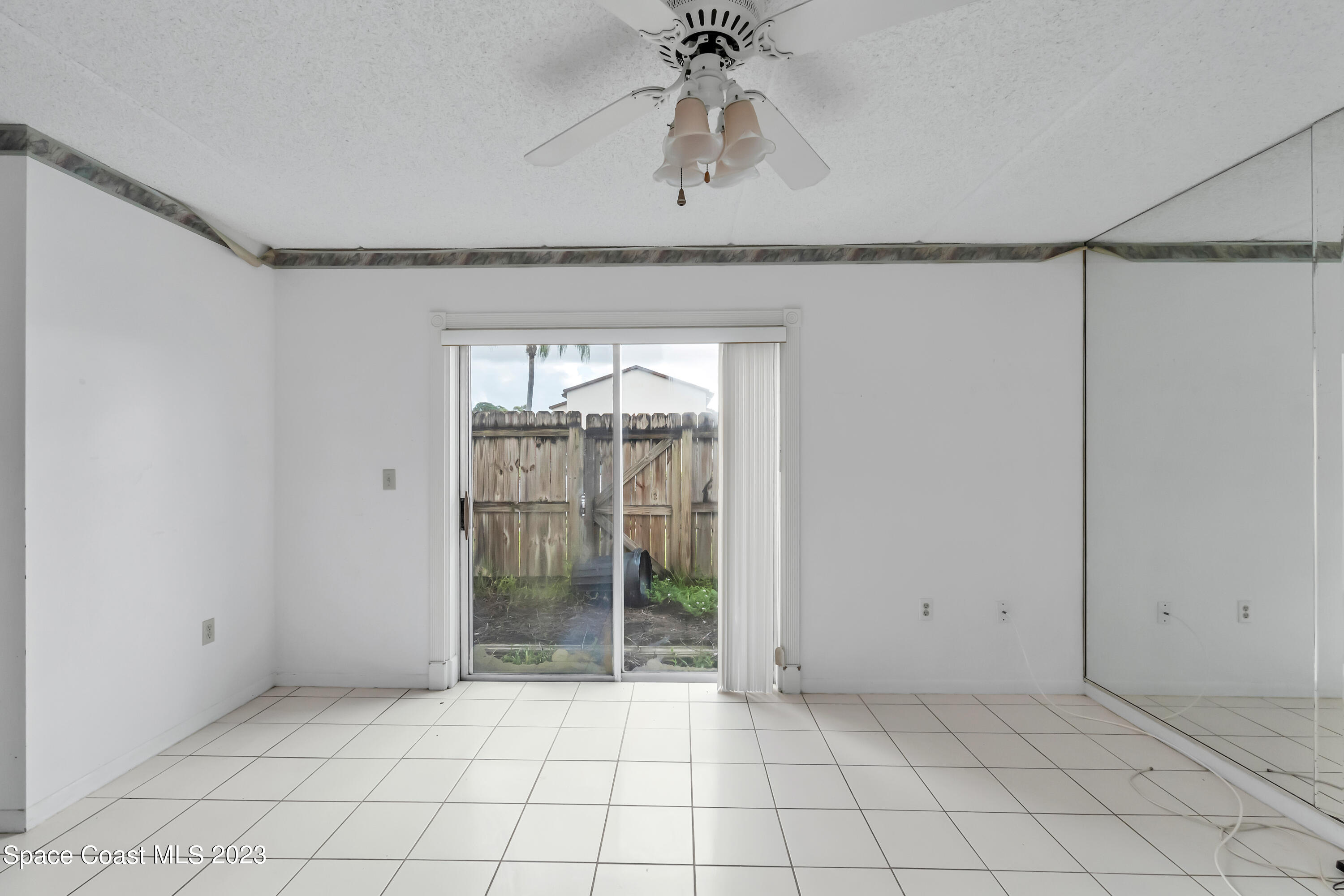 700 Ridge Club Drive, Unit 33 Melbourne, FL 32934 - Photo 12 of 32 a view of an empty room and window