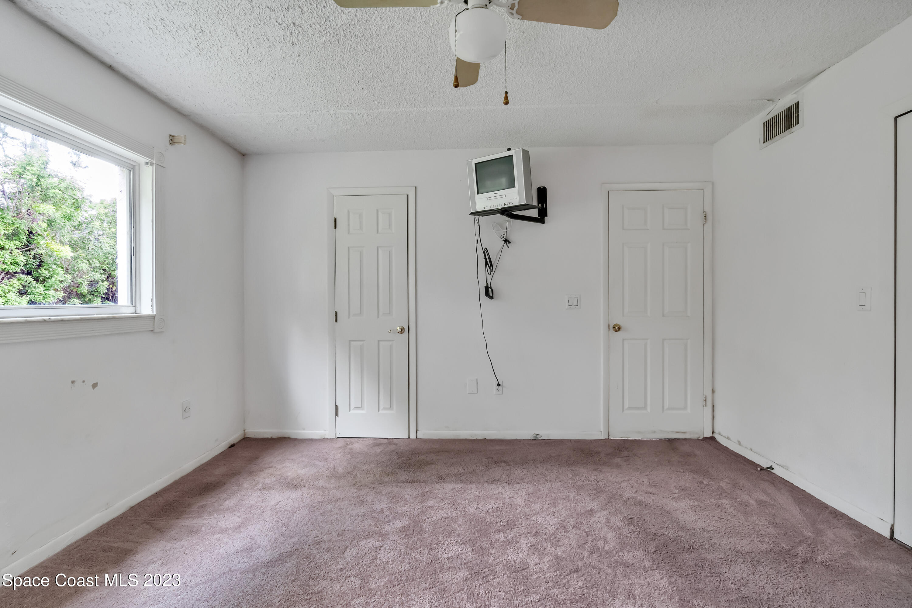 700 Ridge Club Drive, Unit 33 Melbourne, FL 32934 - Photo 14 of 32 a view of empty room with ceiling fan