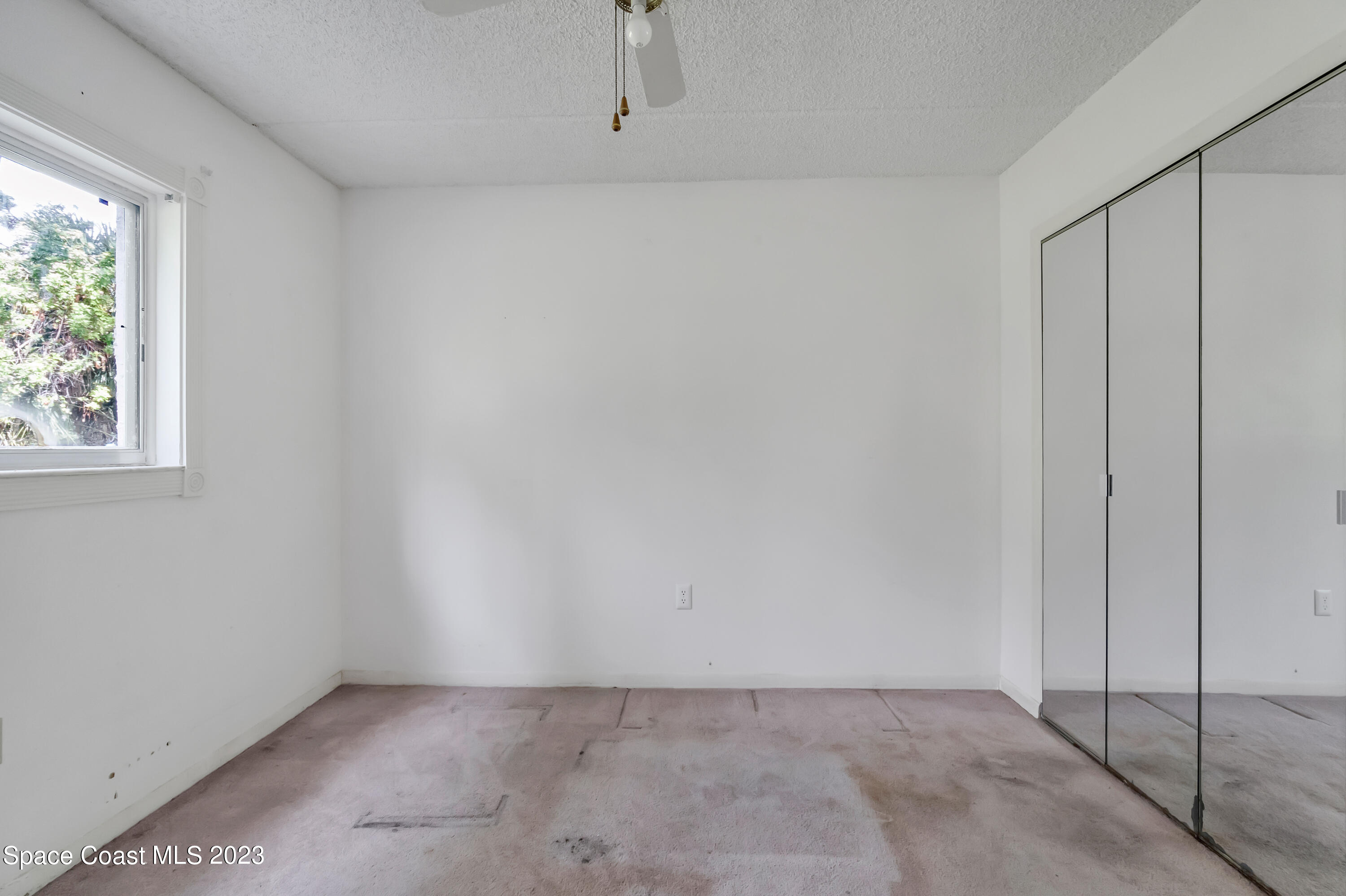 700 Ridge Club Drive, Unit 33 Melbourne, FL 32934 - Photo 19 of 32 an empty room with windows