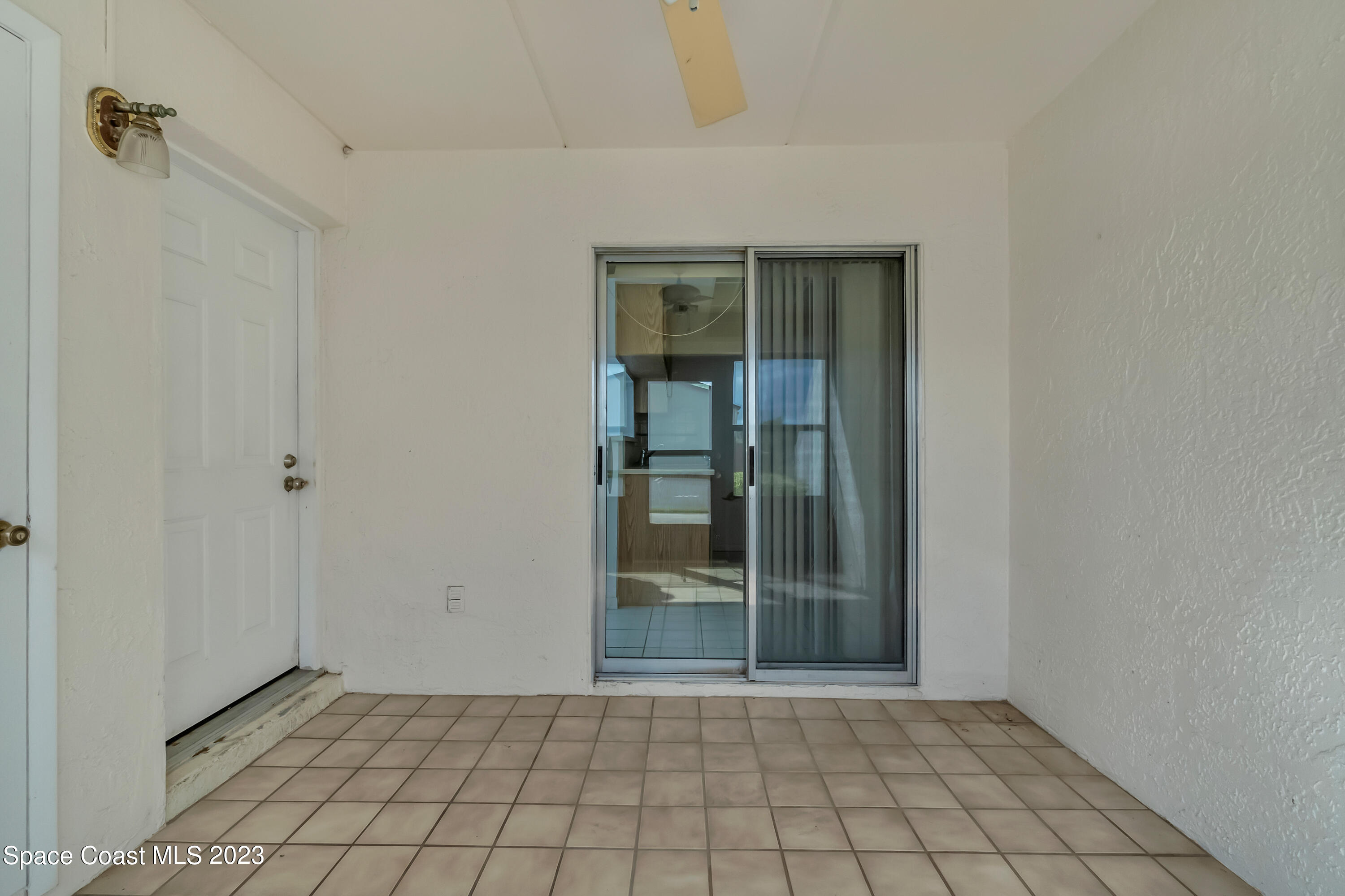 700 Ridge Club Drive, Unit 33 Melbourne, FL 32934 - Photo 2 of 32 a view of an empty room and window
