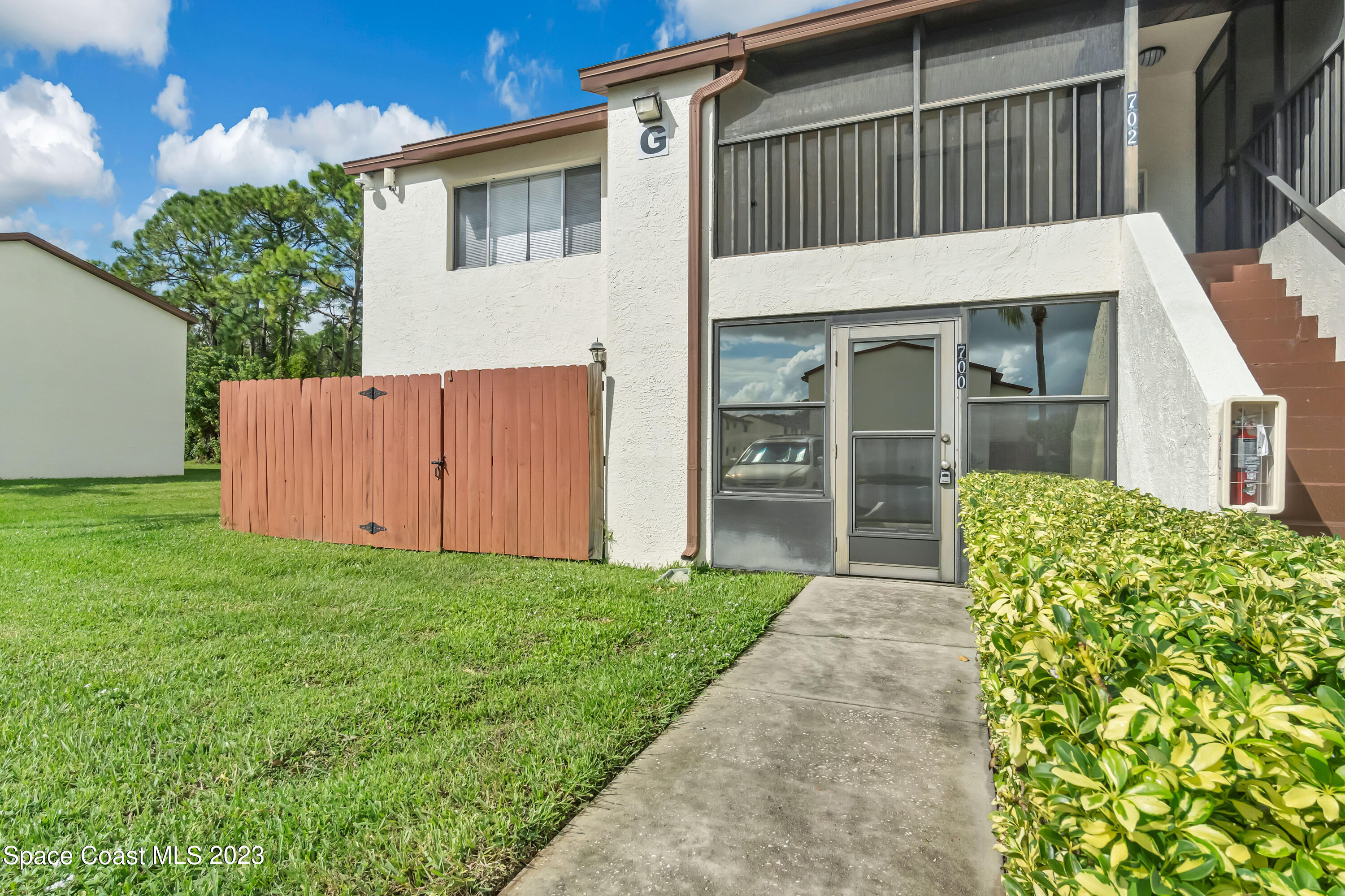 700 Ridge Club Drive, Unit 33 Melbourne, FL 32934 - Photo 24 of 32 a view of a house with a yard