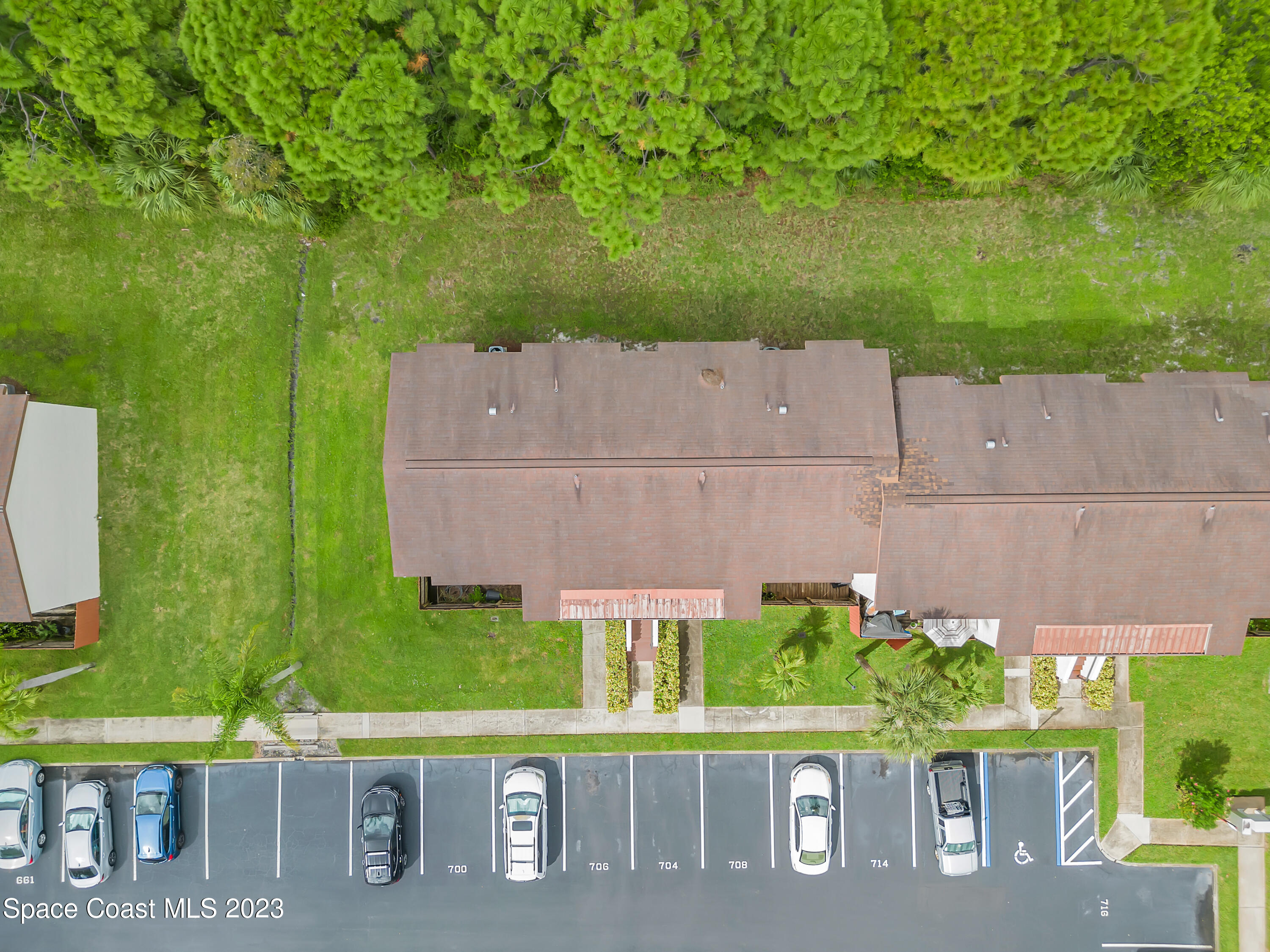 700 Ridge Club Drive, Unit 33 Melbourne, FL 32934 - Photo 29 of 32 an aerial view of a house with garden space and outdoor seating