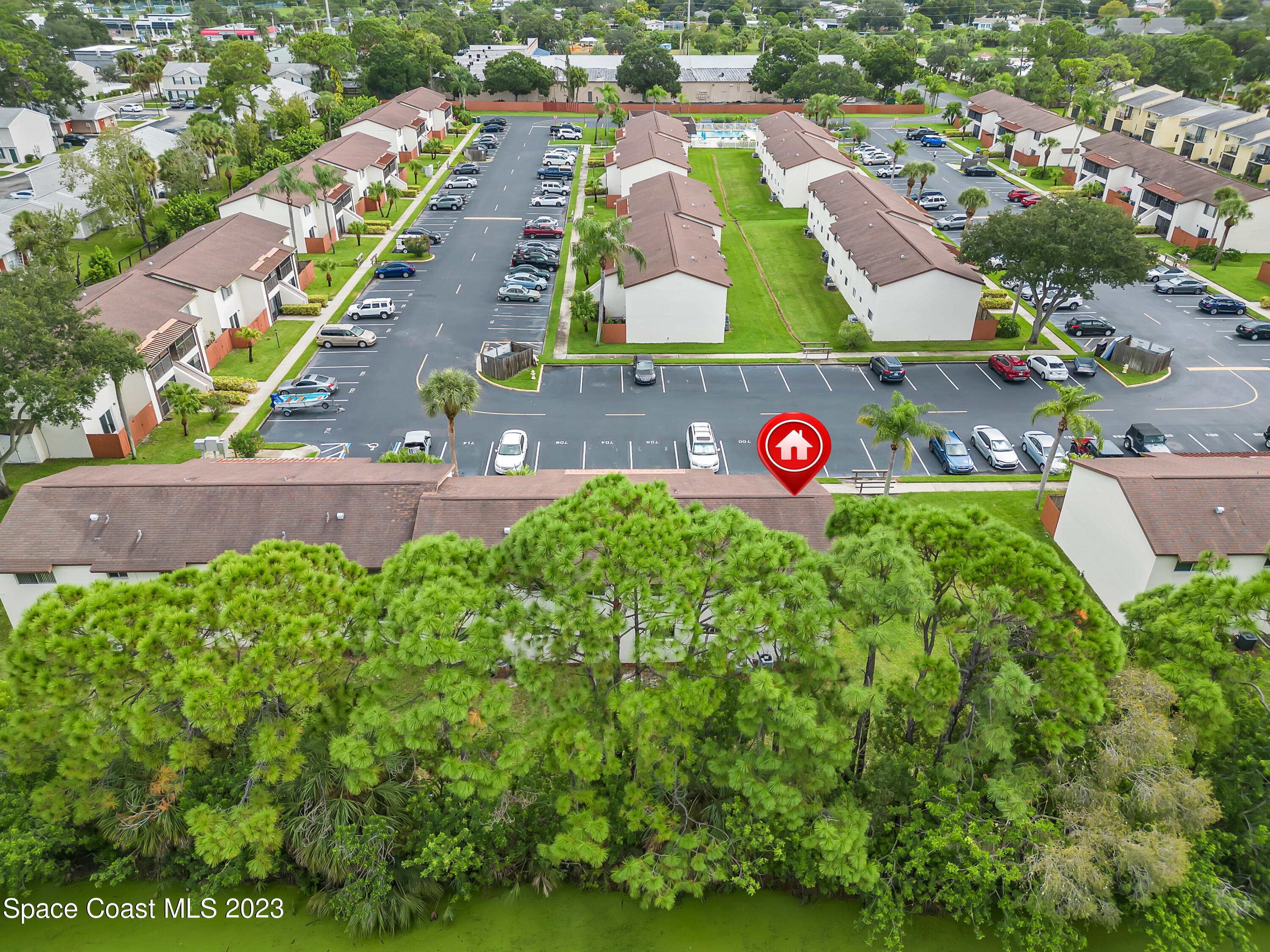 700 Ridge Club Drive, Unit 33 Melbourne, FL 32934 - Photo 32 of 32 an aerial view of residential houses with yard