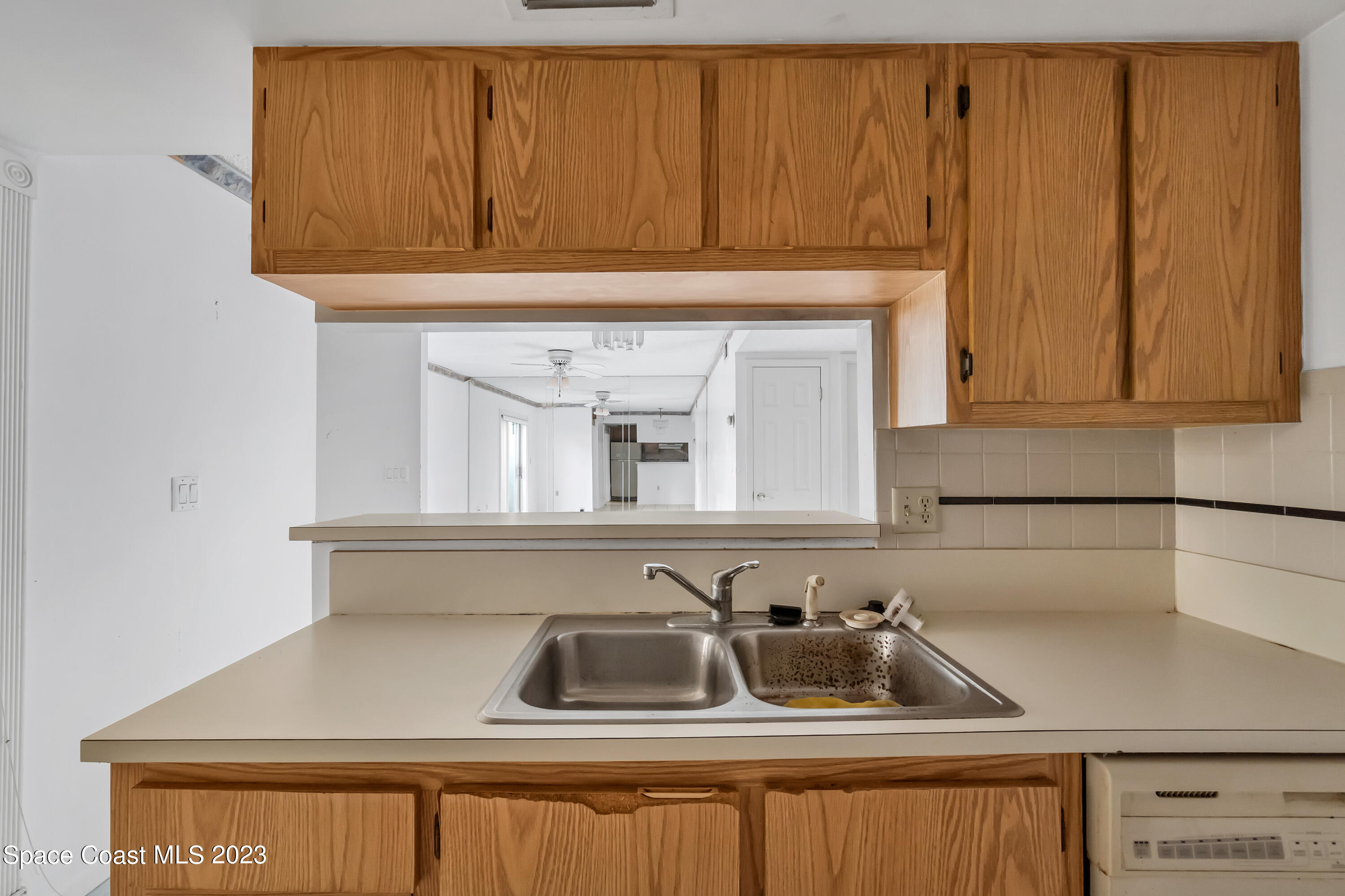 700 Ridge Club Drive, Unit 33 Melbourne, FL 32934 - Photo 7 of 32 a kitchen with a sink and cabinets