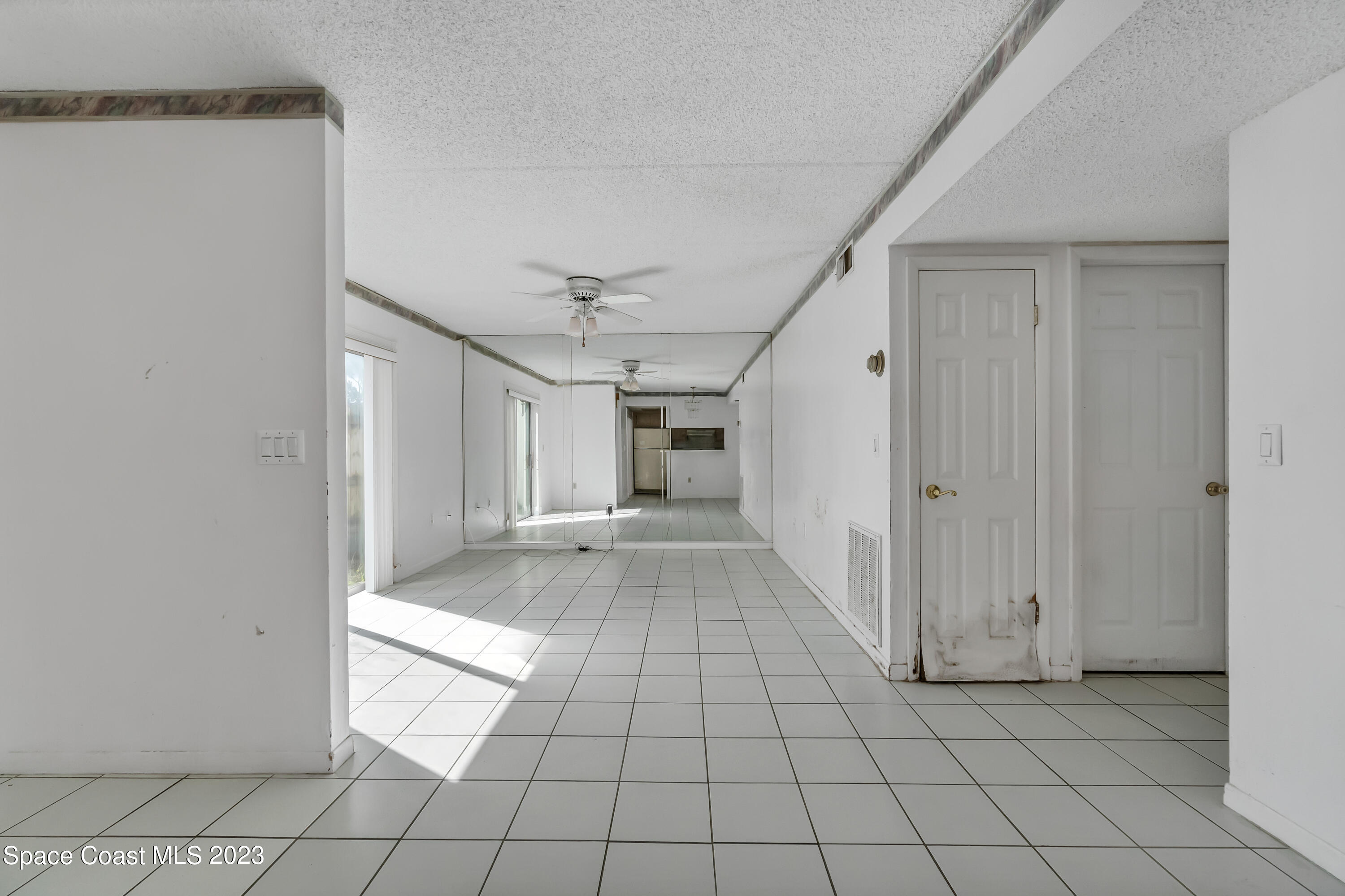 700 Ridge Club Drive, Unit 33 Melbourne, FL 32934 - Photo 9 of 32 a view of a hallway to rooms and stairs