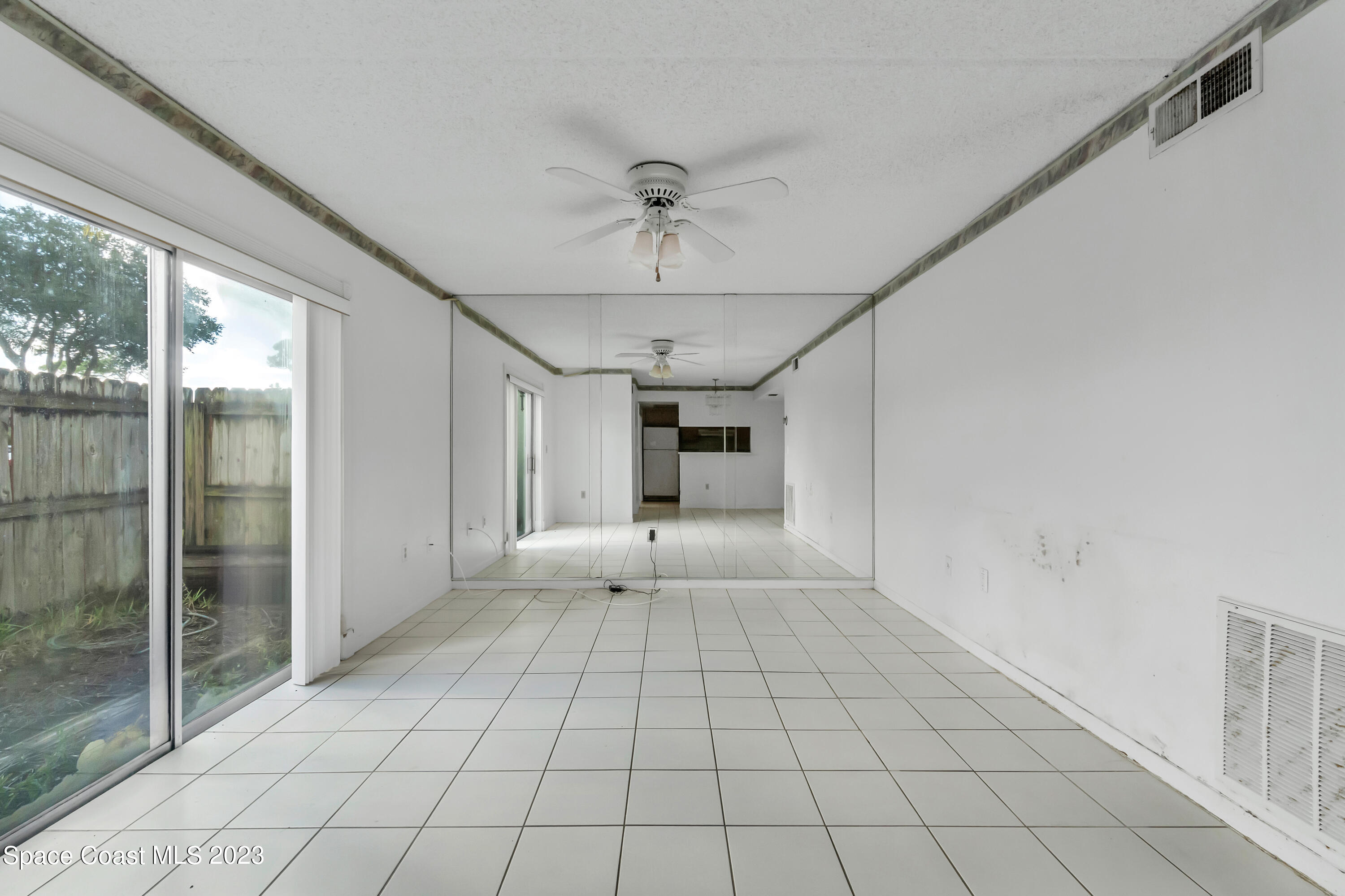 700 Ridge Club Drive, Unit 33 Melbourne, FL 32934 - Photo 10 of 32 a view of an empty room and window