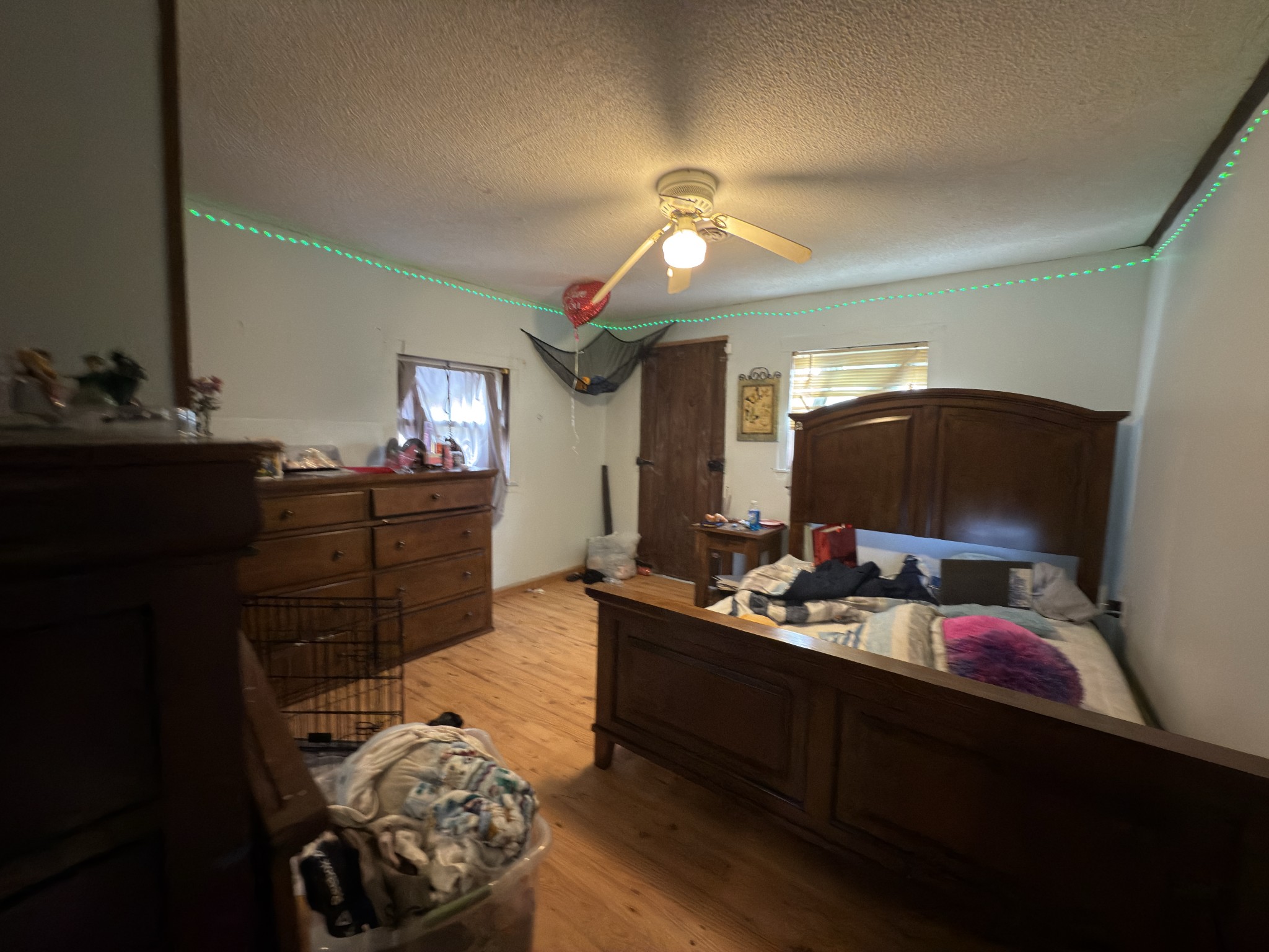 496 Rockhouse Road Hohenwald, TN 38462 - Photo 12 of 36 a bedroom with furniture and a flat screen tv