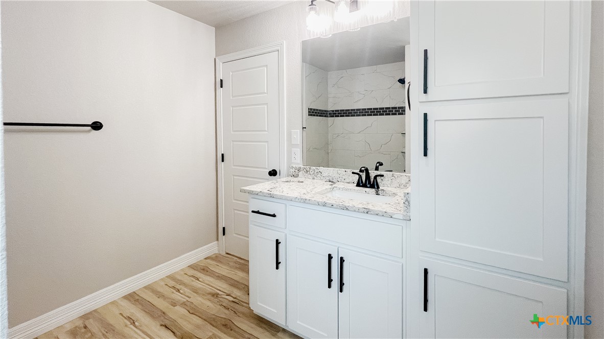 1404 Tahonta Drive Hewitt, TX 76643 - Photo 28 of 32 a bathroom with a sink and a mirror