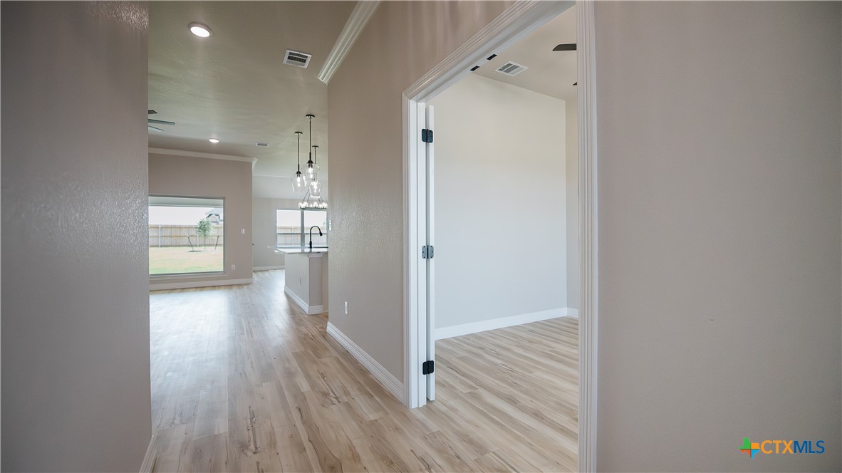 1404 Tahonta Drive Hewitt, TX 76643 - Photo 3 of 32 a view of a hallway with wooden floor
