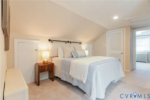 a bedroom with a bed and a table