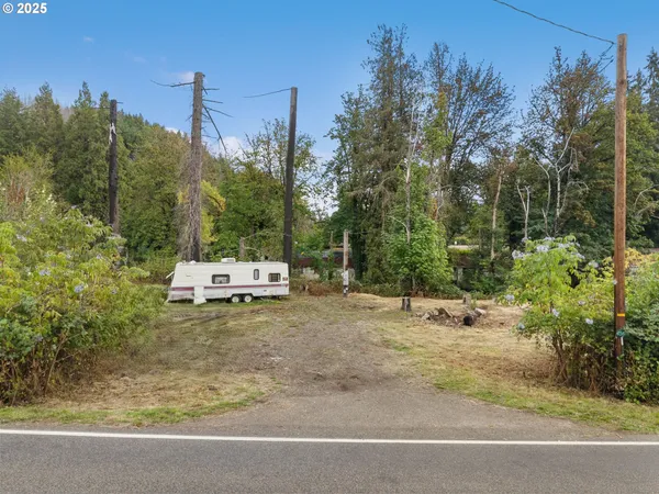 a backyard of a house with a yard and outdoor seating