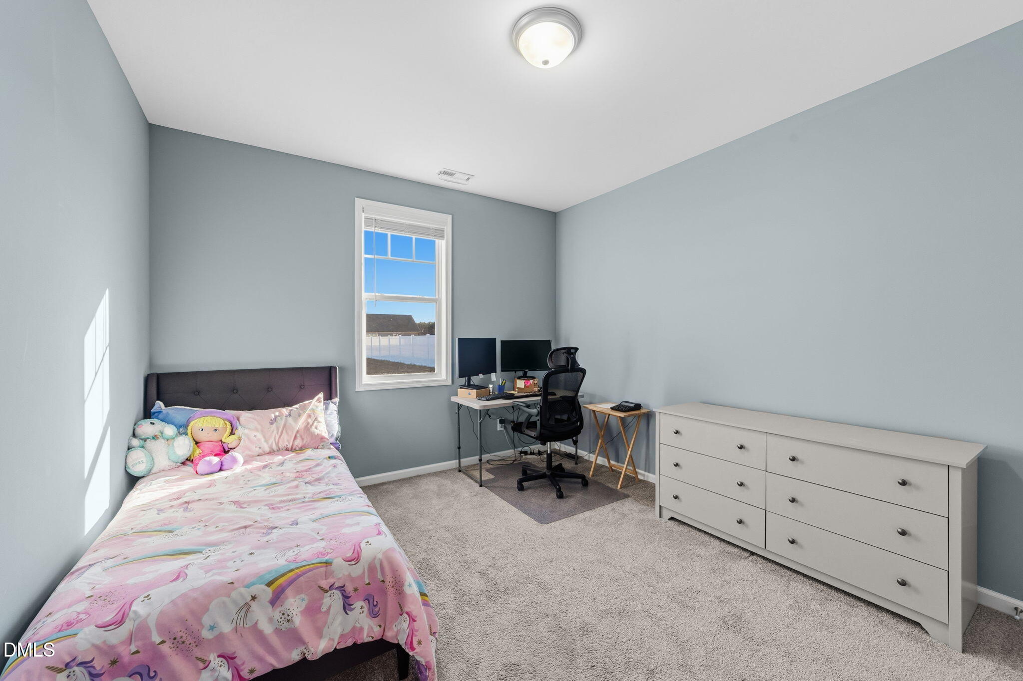 4029 Needham Road Bailey, NC 27807 - Photo 19 of 21 a bedroom with a bed and a chair