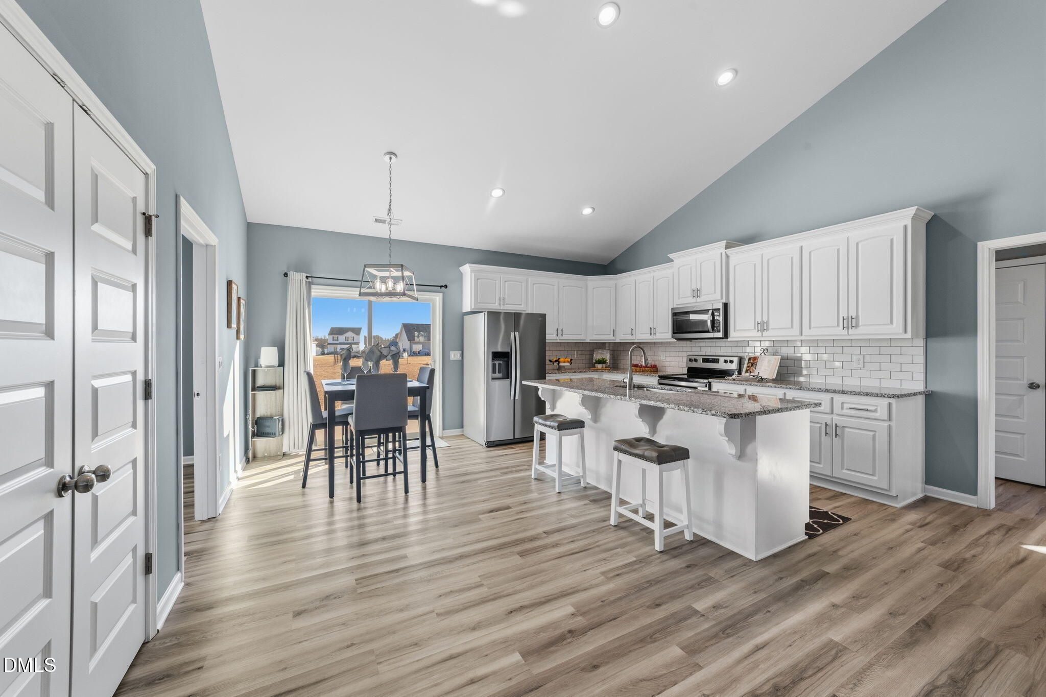 4029 Needham Road Bailey, NC 27807 - Photo 7 of 21 a kitchen with white cabinets and wooden floor