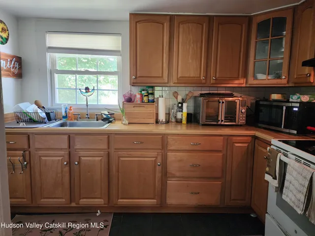 a kitchen with sink cabinets and window