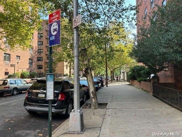 99-10 60th Avenue, Unit 5L Queens, NY 11368 - Photo 13 of 13 a street view with couple of cars parked on road