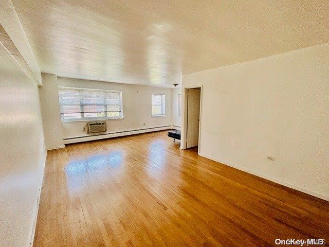 99-10 60th Avenue, Unit 5L Queens, NY 11368 - Photo 6 of 13 a view of a livingroom with wooden floor