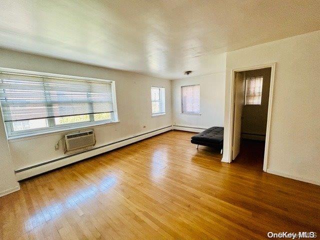 99-10 60th Avenue, Unit 5L Queens, NY 11368 - Photo 8 of 13 a view of empty room with wooden floor and fan