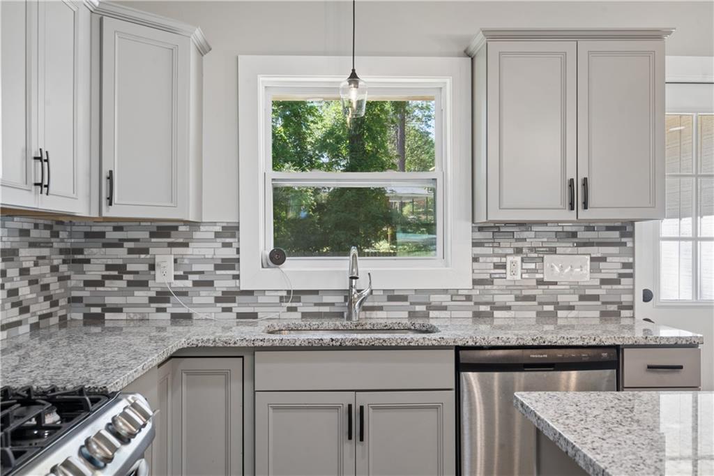 2357 Scotty Circle Decatur, GA 30032 - Photo 19 of 44 a kitchen with granite countertop a sink and a window