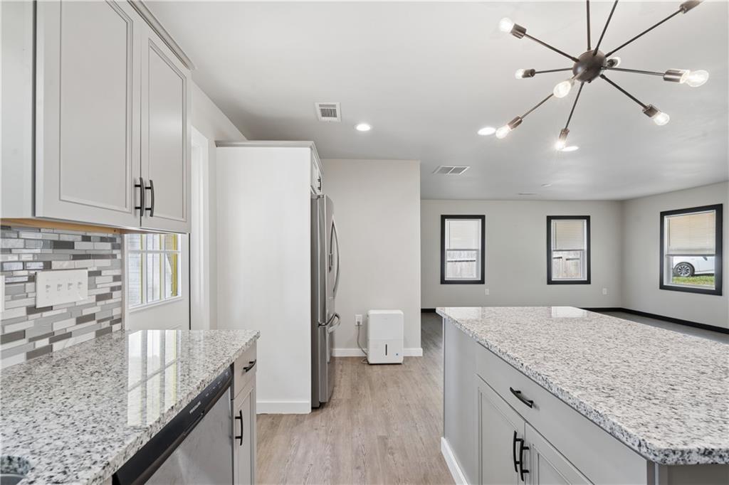2357 Scotty Circle Decatur, GA 30032 - Photo 22 of 44 a spacious bathroom with a granite countertop sink and a refrigerator
