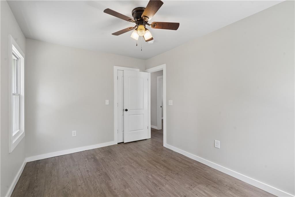 2357 Scotty Circle Decatur, GA 30032 - Photo 34 of 44 a view of a room with wooden floor and a ceiling fan