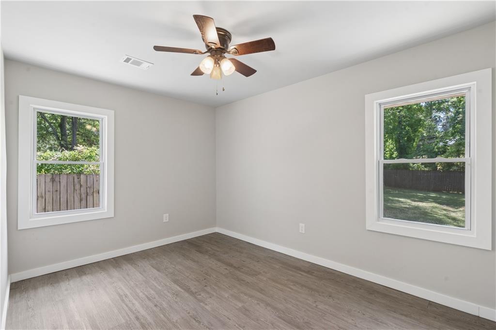 2357 Scotty Circle Decatur, GA 30032 - Photo 36 of 44 a view of a big room with wooden floor and windows