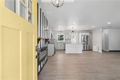 a view of a kitchen with furniture and a window
