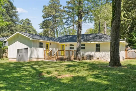 a front view of house with yard and seating area