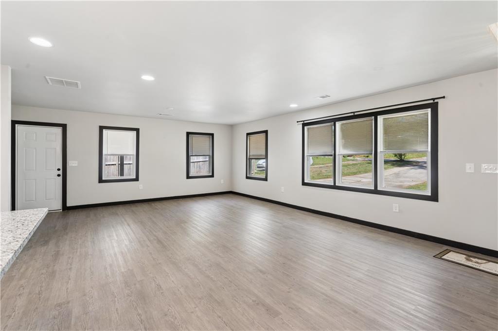 2357 Scotty Circle Decatur, GA 30032 - Photo 6 of 44 a view of an empty room with a window and wooden floor