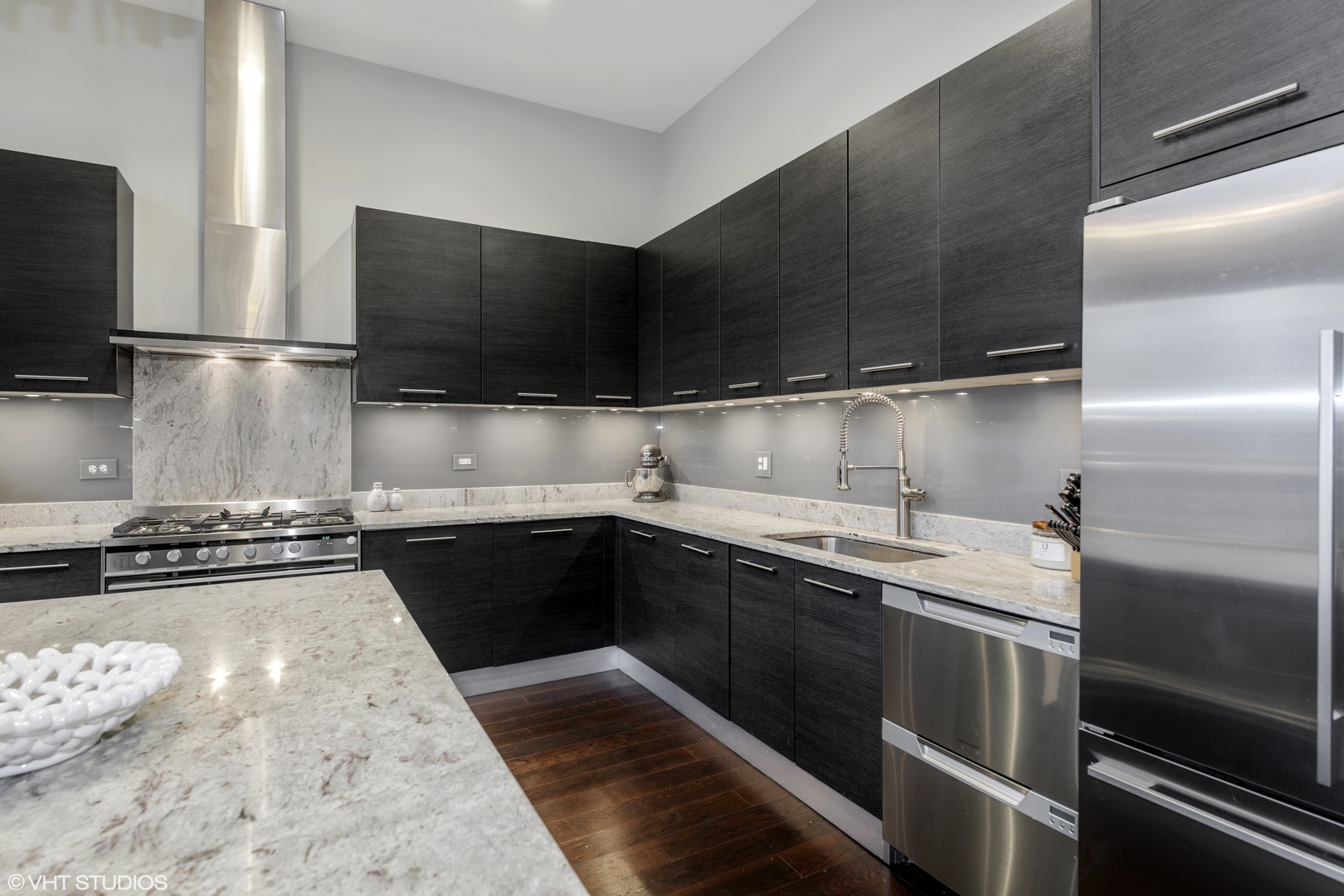 18 North Carpenter Street, Unit PHS Chicago, IL 60607 - Photo 11 of 33 a kitchen with a sink and stainless steel appliances