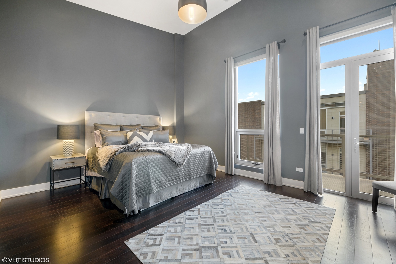 18 North Carpenter Street, Unit PHS Chicago, IL 60607 - Photo 17 of 33 a bedroom with a bed and wooden floor