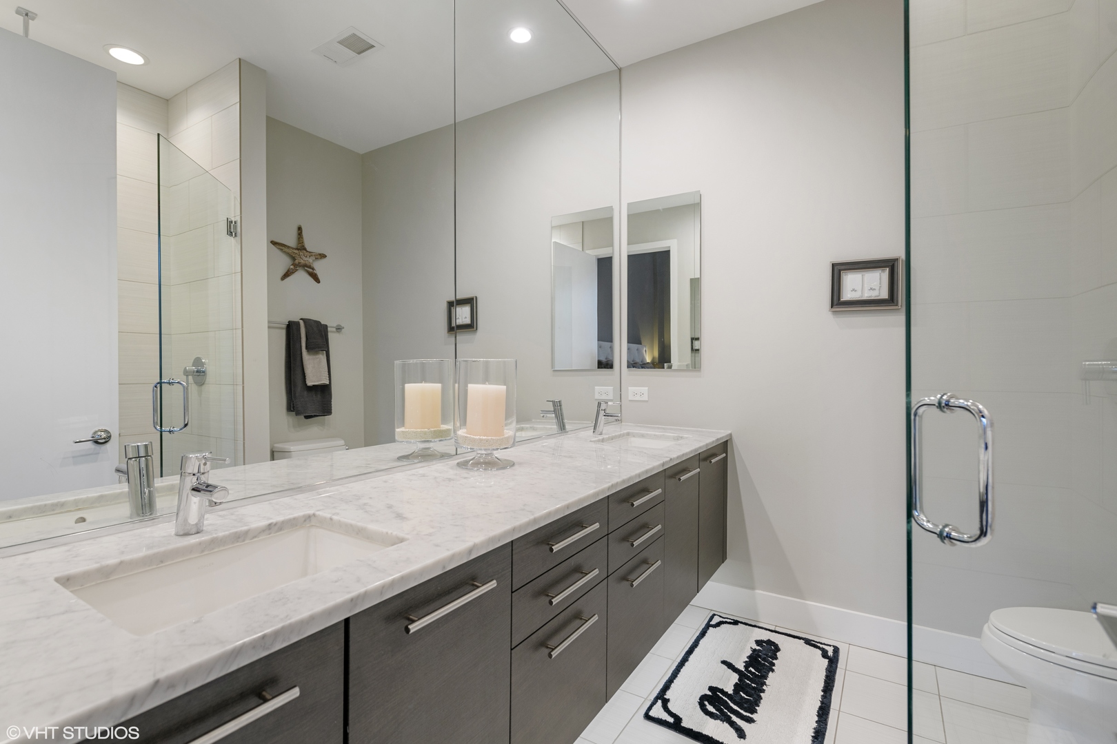 18 North Carpenter Street, Unit PHS Chicago, IL 60607 - Photo 20 of 33 a bathroom with a granite countertop sink a toilet and shower