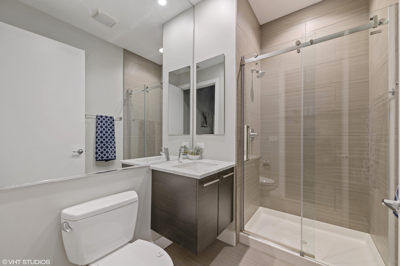 18 North Carpenter Street, Unit PHS Chicago, IL 60607 - Photo 22 of 33 a bathroom with a toilet sink and shower