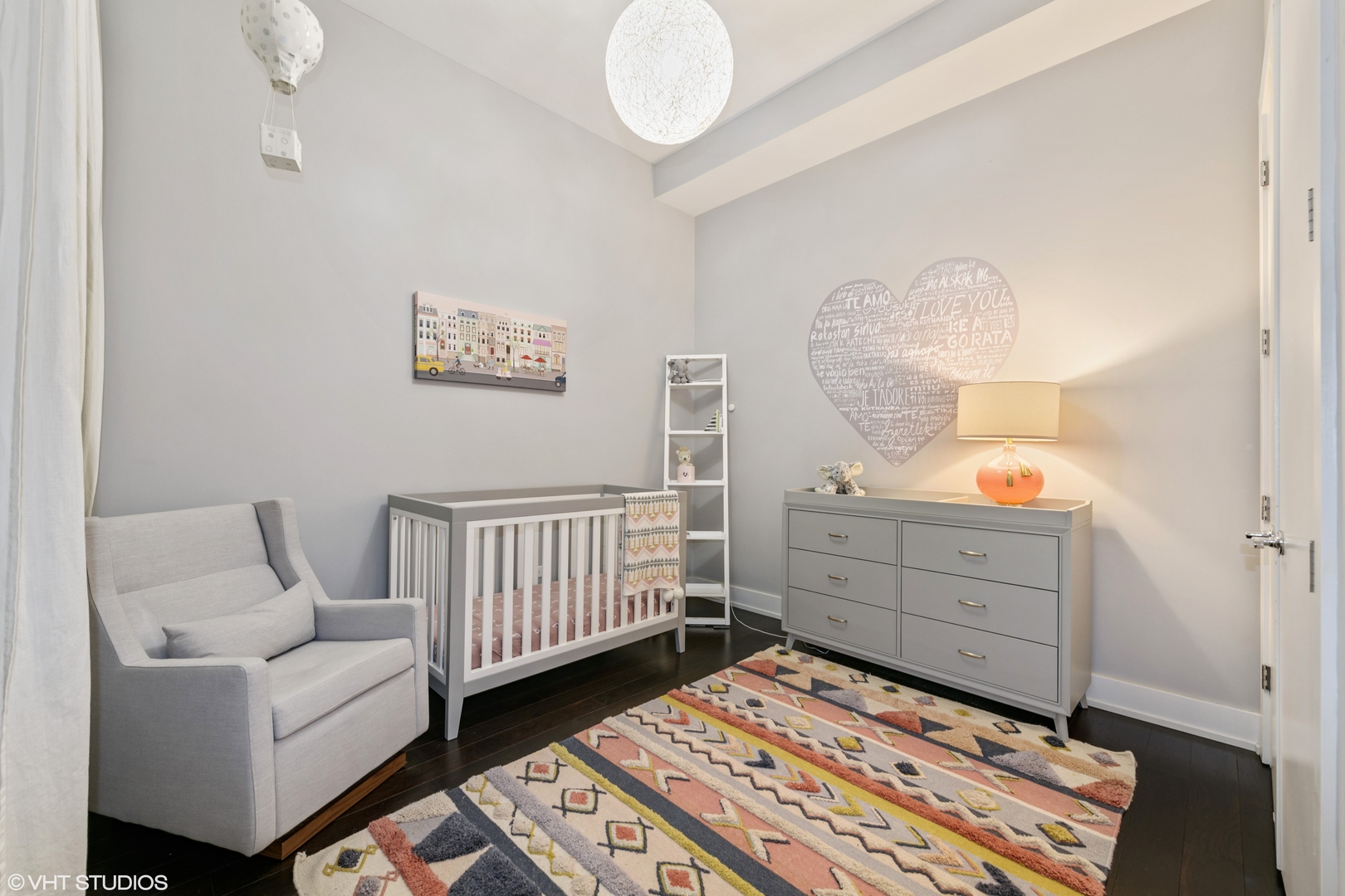 18 North Carpenter Street, Unit PHS Chicago, IL 60607 - Photo 23 of 33 a bedroom with a baby bed baby crib and a dresser