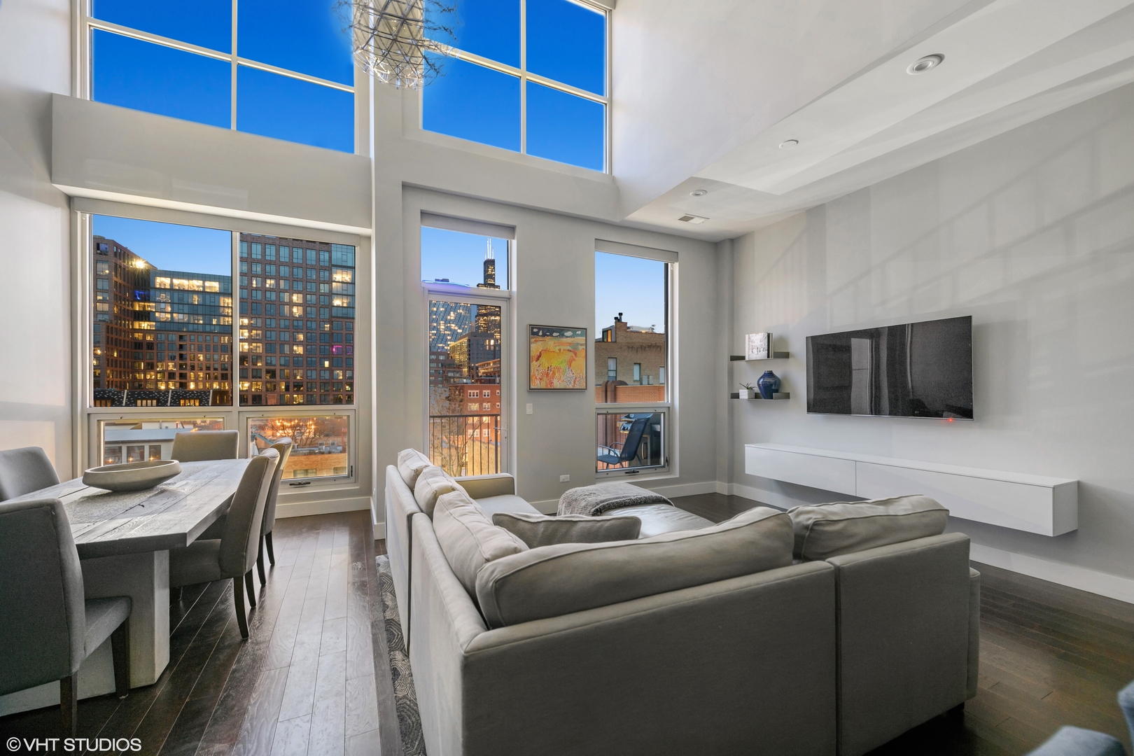 18 North Carpenter Street, Unit PHS Chicago, IL 60607 - Photo 31 of 33 a living room with furniture and a flat screen tv