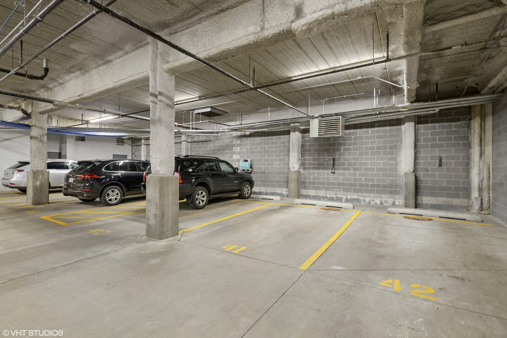 18 North Carpenter Street, Unit PHS Chicago, IL 60607 - Photo 32 of 33 a view of parking garage with cars