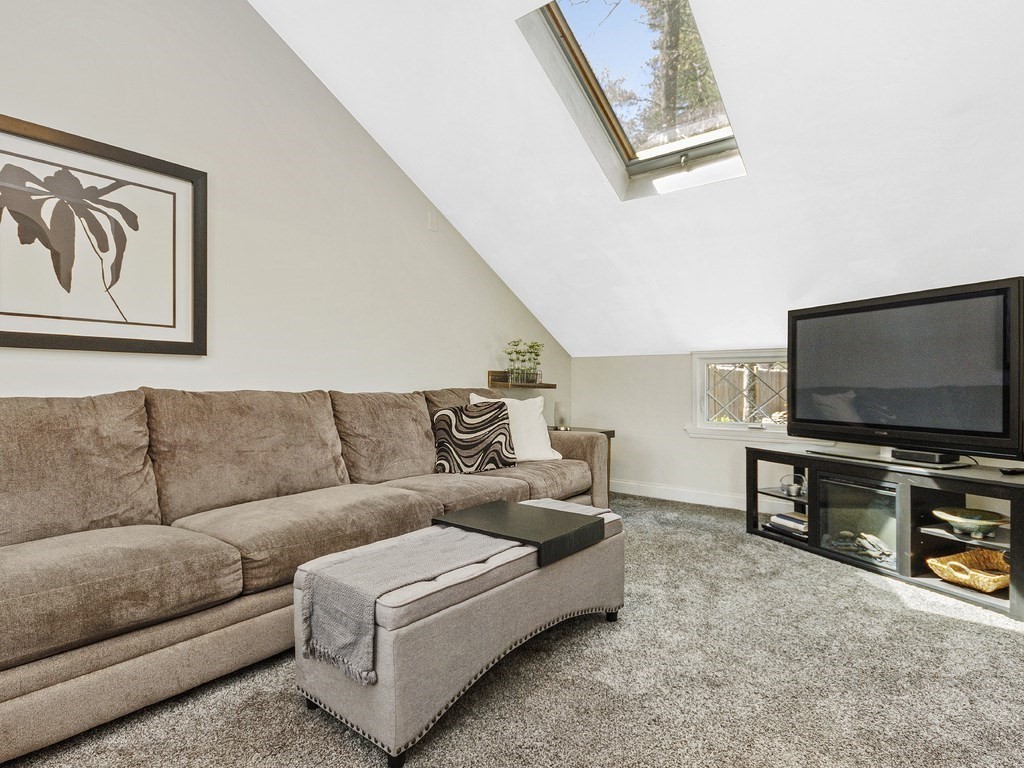 435 Old Post Road Walpole, MA 02081 - Photo 11 of 36 a living room with furniture and a flat screen tv