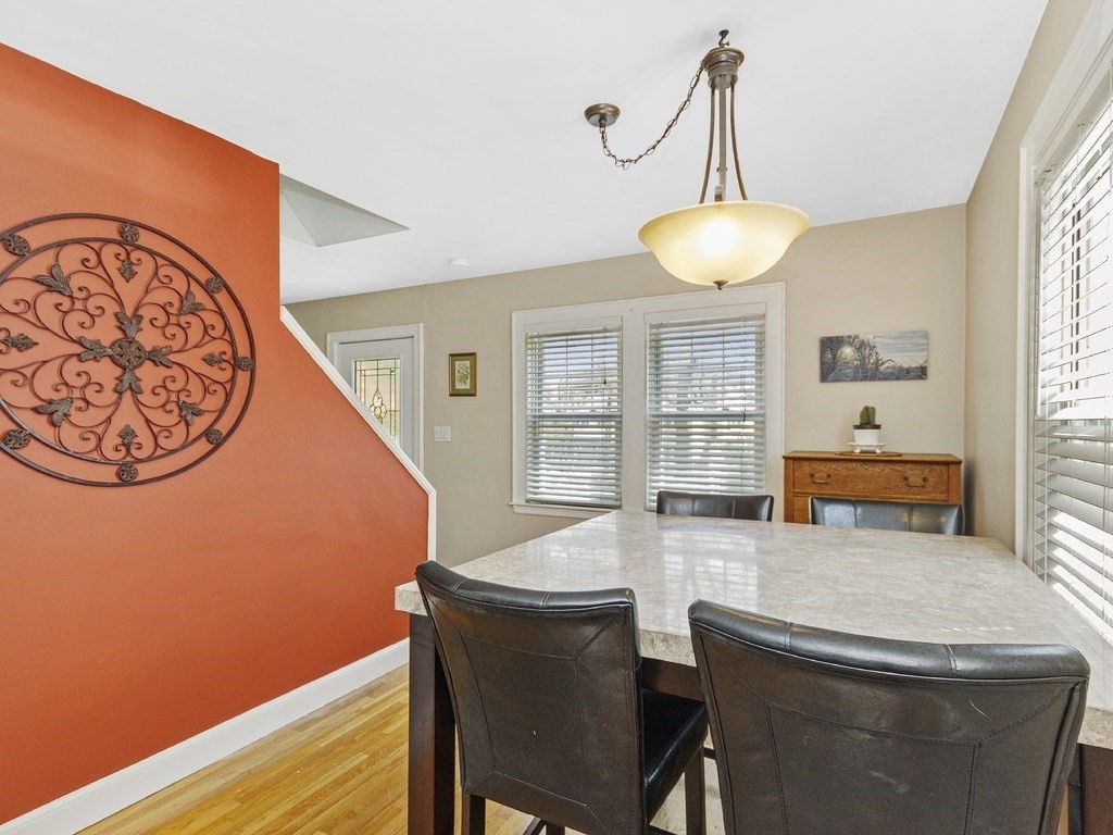 435 Old Post Road Walpole, MA 02081 - Photo 15 of 36 a dining room with wooden floor and large windows