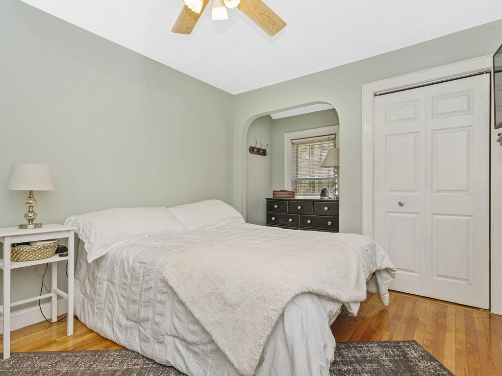 435 Old Post Road Walpole, MA 02081 - Photo 17 of 36 a bedroom with a bed and dresser with mirror