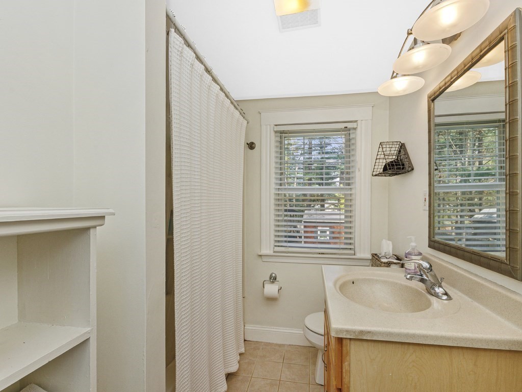 435 Old Post Road Walpole, MA 02081 - Photo 21 of 36 a bathroom with a sink and a mirror