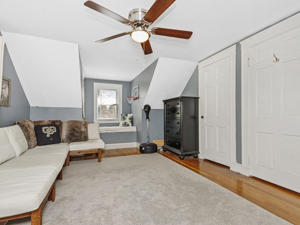 435 Old Post Road Walpole, MA 02081 - Photo 23 of 36 a view of a livingroom with hardwood floor and a ceiling fan